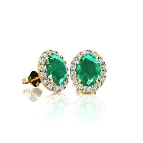 1 3/4 Carat Oval Shape Emerald And Halo Diamond Stud Earrings In 14 Karat Yellow Gold